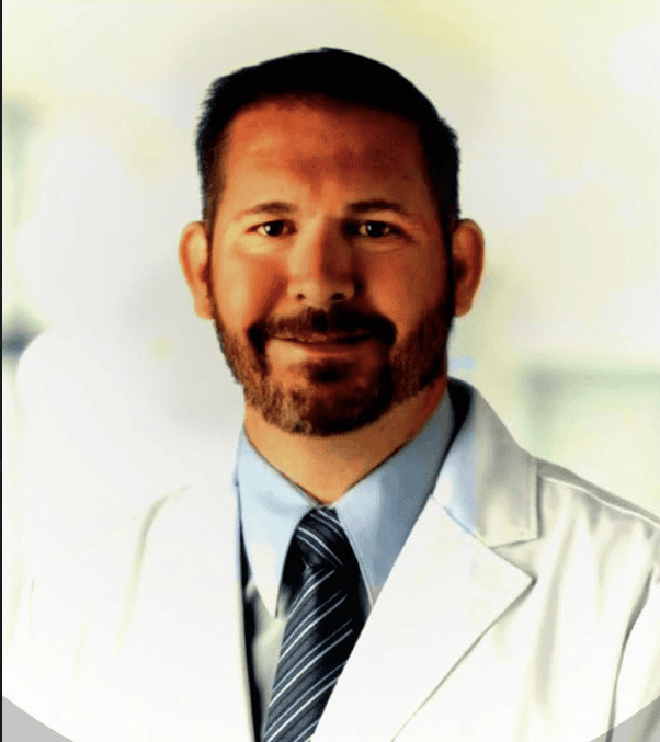 Smiling doctor in white coat