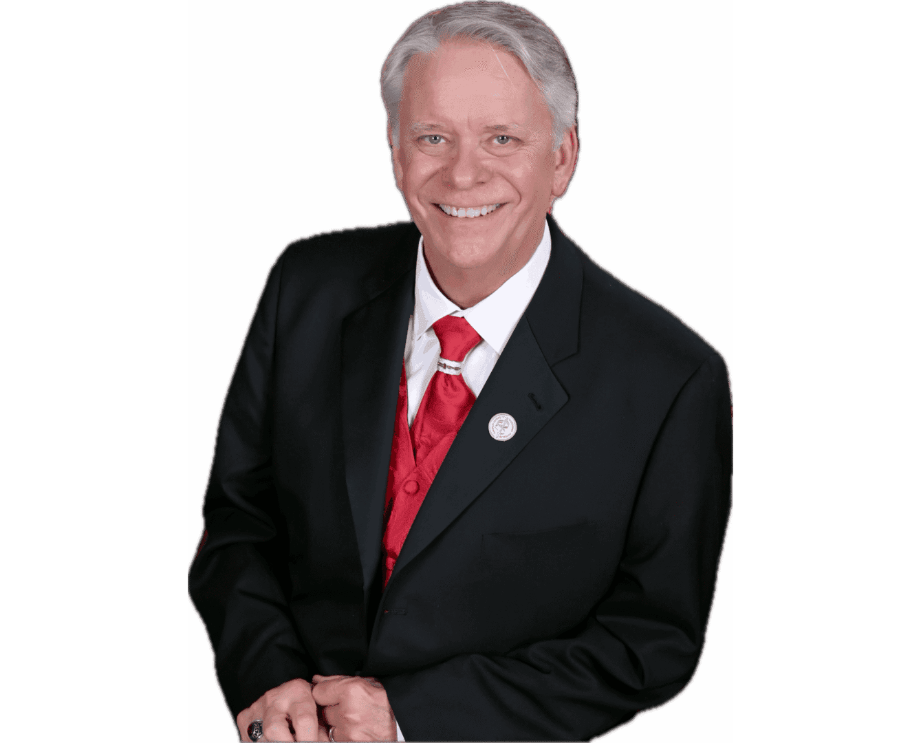 Smiling man in black suit, red tie